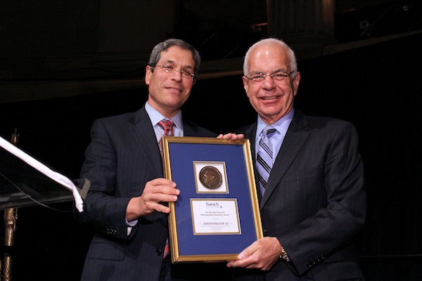 (Left) Joe Schenker presents the Distinguished Alumni Award to Joseph Macnow ?67.  