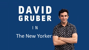 David Gruber stands with his arms folded against a graphic backdrop noting his coverage in The New Yorker.
