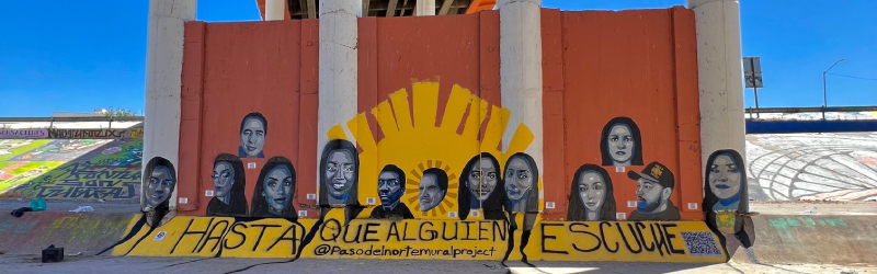 The El Paso del Norte Mural Project, installed under a bridge in Juarez, Mexico. The mural features 13 faces of deported migrants and has the words "hasta que alguien escuche" beneath the faces.